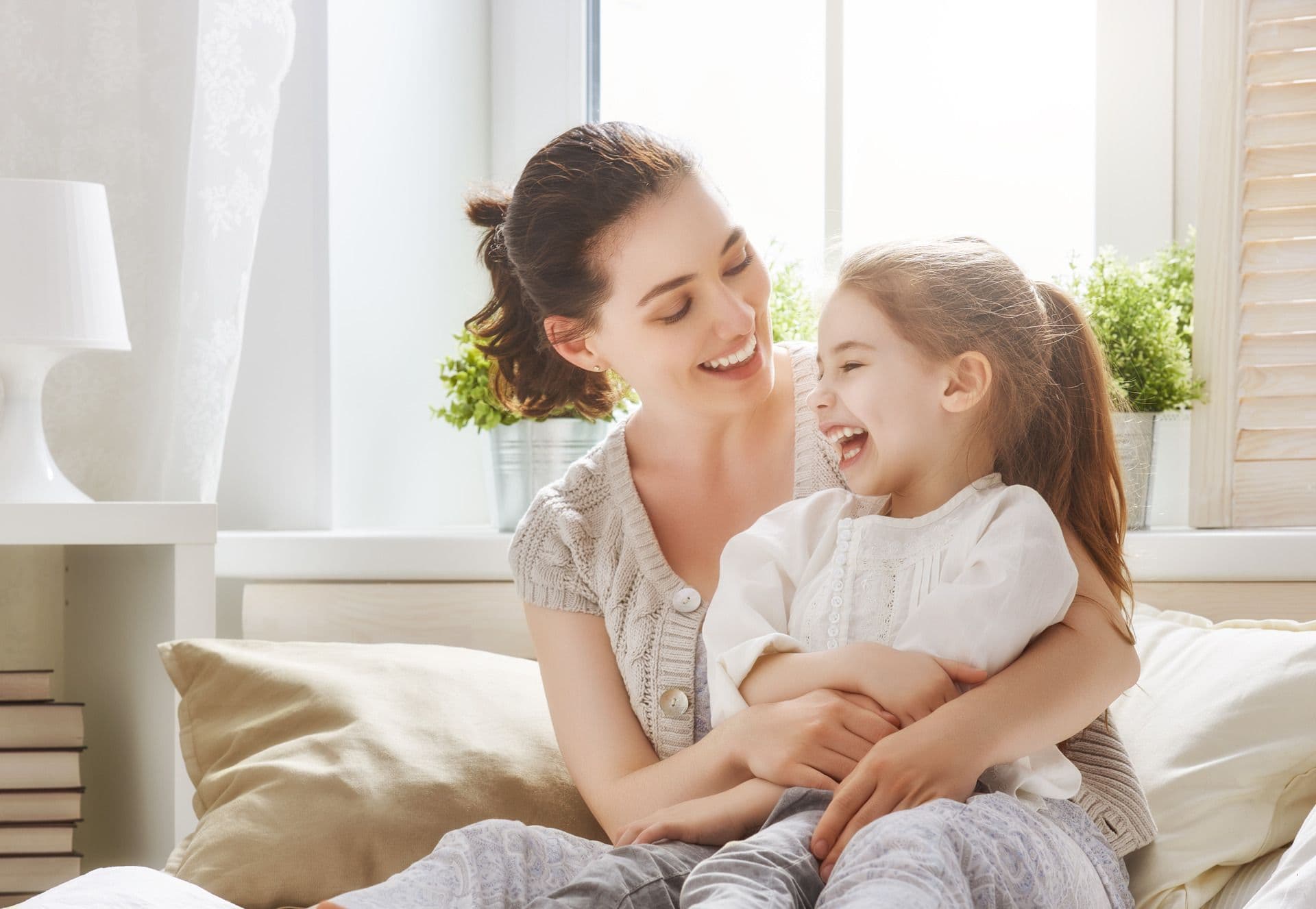 Mother and Daughter in front of Vinyl Windows